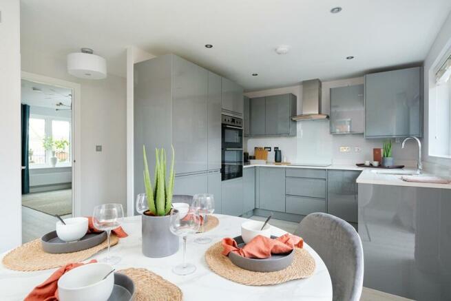 Open plan kitchen/dining area with French doors to the garden