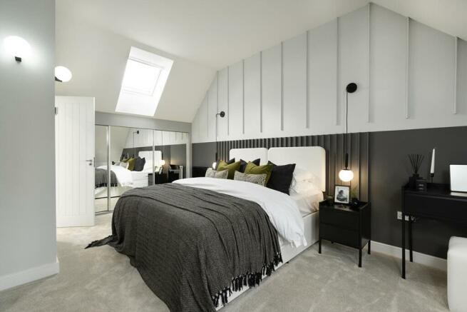 The main bedroom enjoys seclusion on the top floor with high galleried ceiling