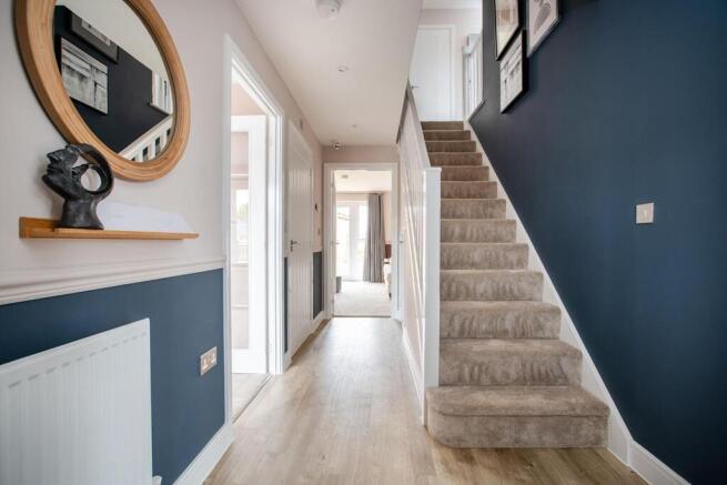 The central hallway with under stairs storage