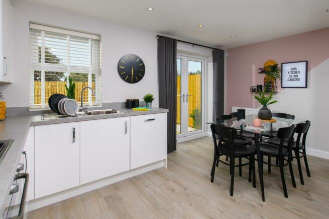 The Archford Show Home kitchen diner with French doors to the garden