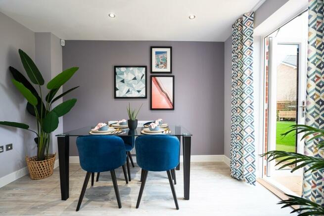 French doors fill the dining area with light, that travels through the home