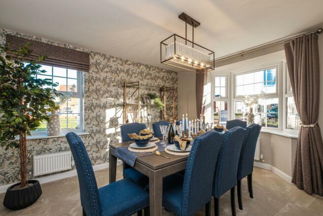 bay-fronted dining room with navy decor
