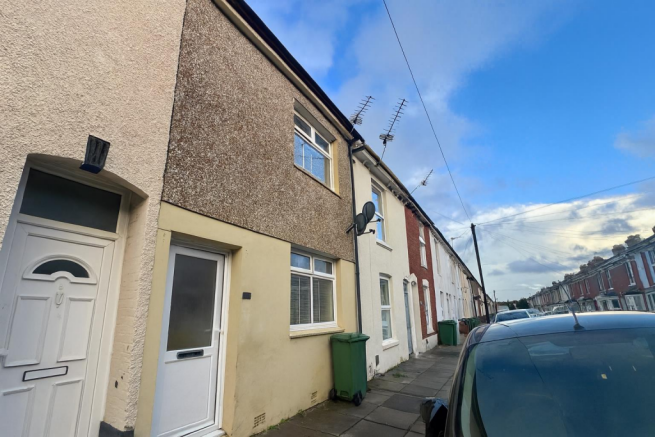 Row of Terraced Houses on Quiet Street.png