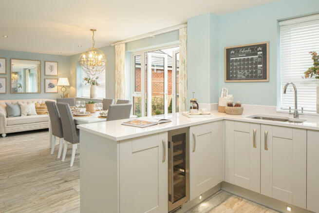 Open plan kitchen with French doors to the garden in a Radleigh