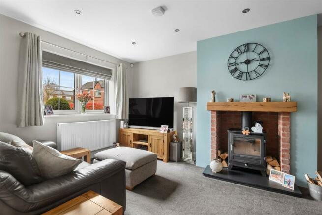 5 Ardley Meadows - living room (brochure).jpg