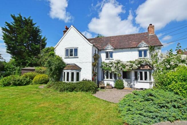 Meadow Cottage, front with roses.jpg