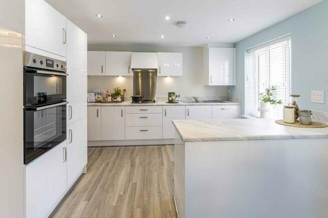 Beautifully designed kitchen with breakfast bar