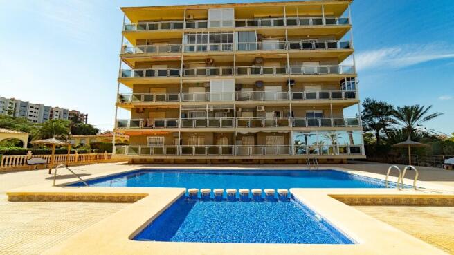 Punta Prima Apartment with pool close to sea.