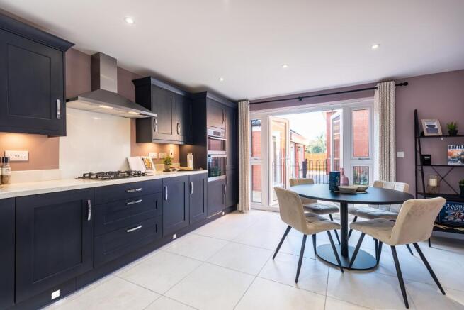 Open-plan kitchen diner with family seating space and french doors onto your rear garden