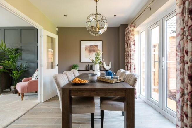 Traditional dining room with French doors to the rear garden