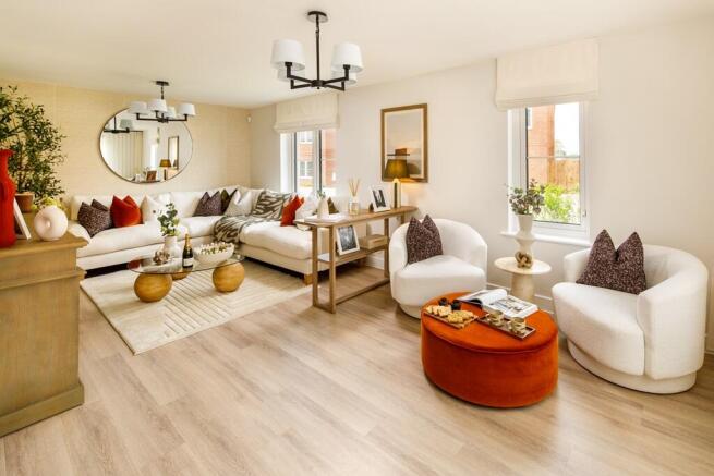 The large living room is spacious and features double aspect windows