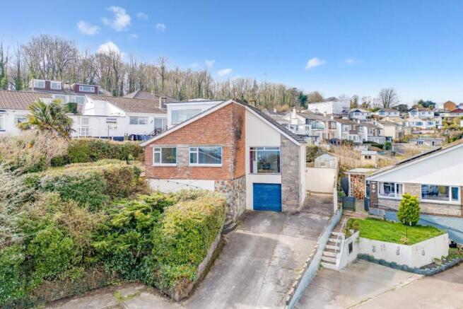 Detached home with ample driveway parking & garage