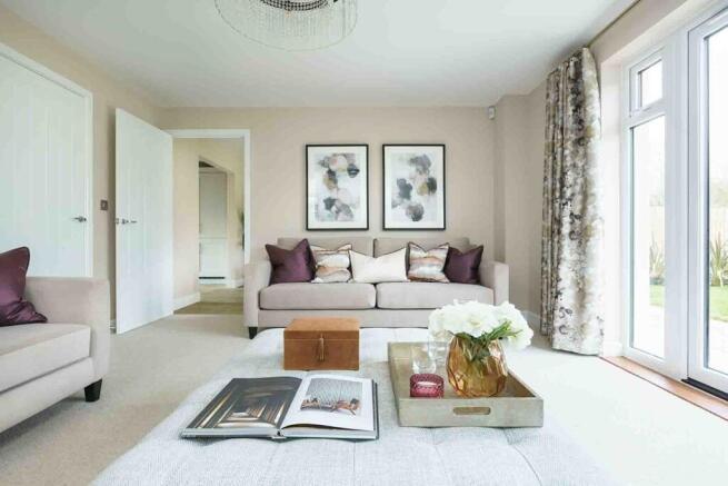 Open plan lounge with French doors opening to the garden