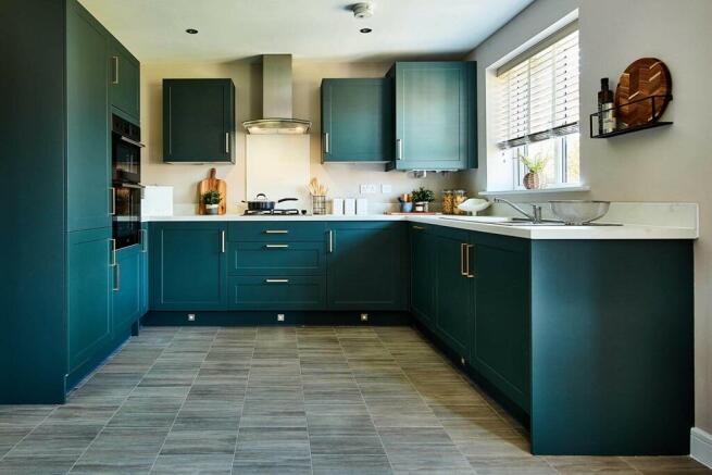 The kitchen features ample storage - typical Taylor Wimpey home