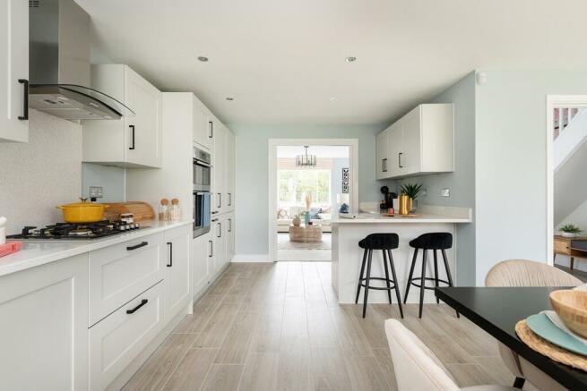 The L shaped kitchen dining room includes plenty or storage
