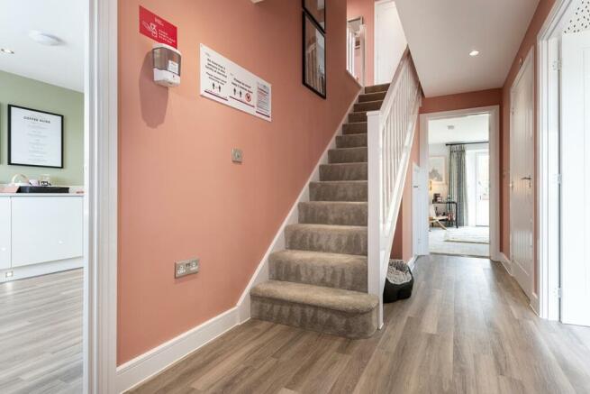 Welcoming hallway with storage cupboard