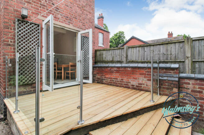 Decked patio with glass balustrades