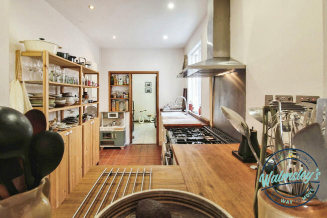 Kitchen with utility & storage beyond