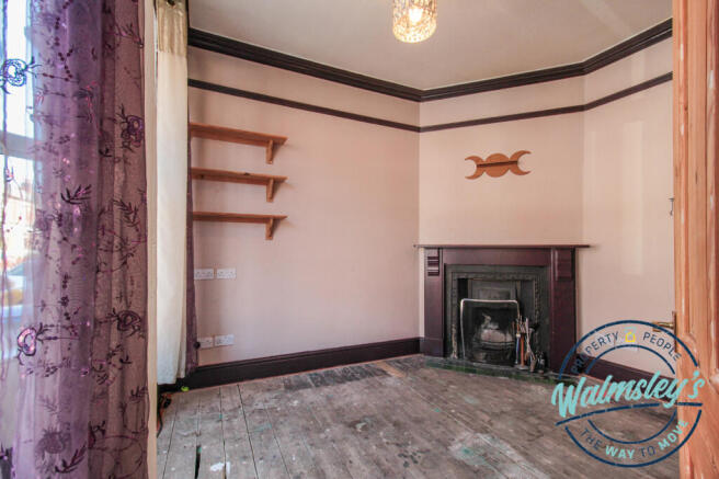 Front sitting room with working & original firepla
