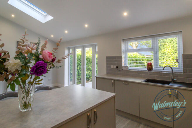 Kitchen towards garden with island unit