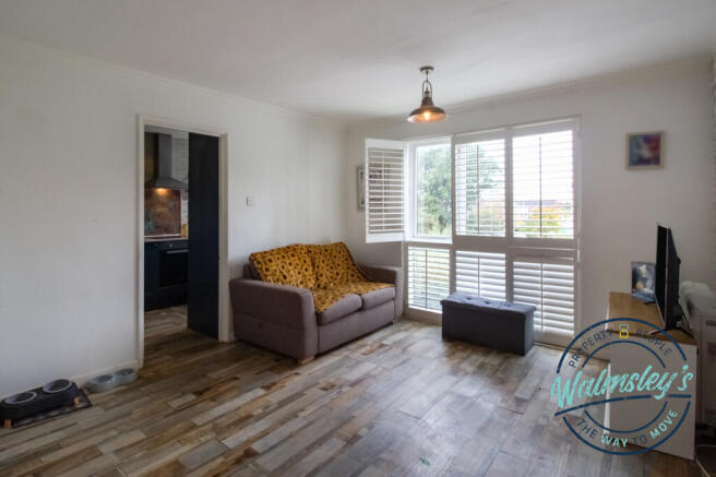 Sitting room with doorway to kitchen