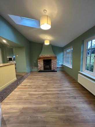 Kitchen dining area with wood burner