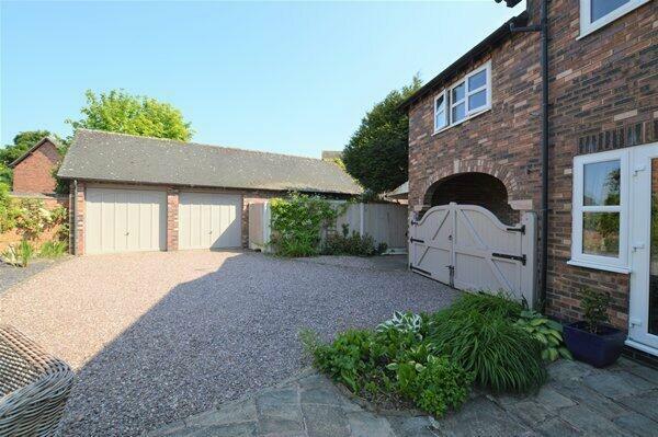 gated parking area & double garage