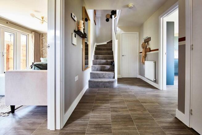 A welcoming hallway sits central to the home - typical Taylor Wimpey home