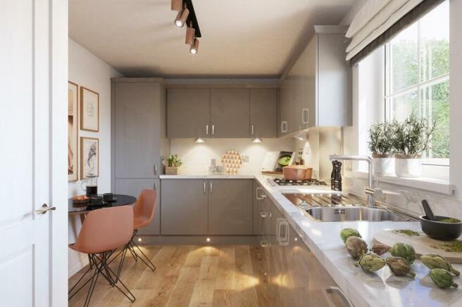 L shaped grey kitchen with a window to the right