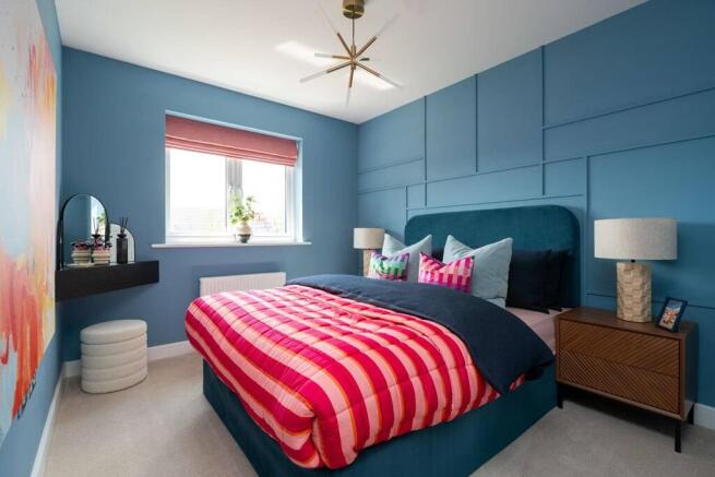 A spacious main bedroom to unwind and relax