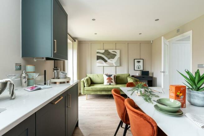 The kitchen/diner features a sofa area plus double doors leading to the garden