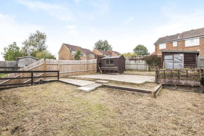 Private rear garden with level lawn area, raise...