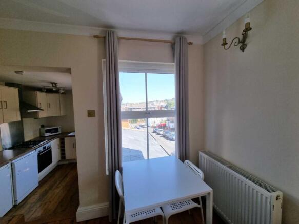 Bright eat-in kitchen with a dine-in table by a...