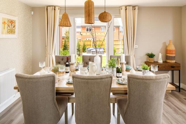 Your dining area looks over your garden through French doors