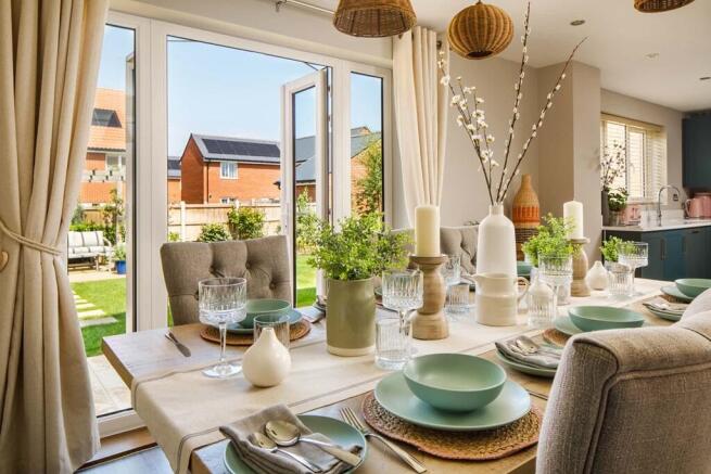 Your dining area looks over your garden through French doors