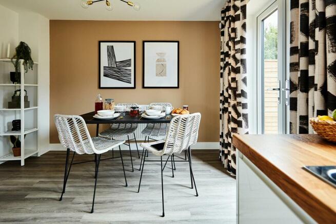 The kitchen and dining area opens through double doors to the garden