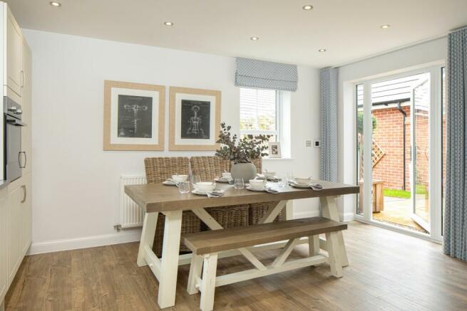 Open plan kitchen with dining area in the Alderney 4 bedroom home