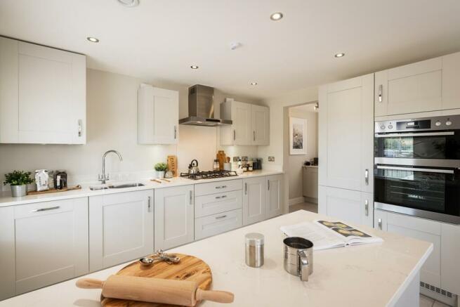 Open plan fitted kitchen with breakfast bar