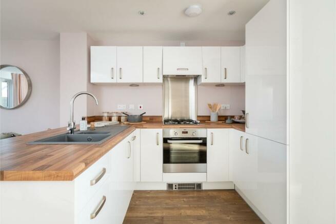 Fitted kitchen with ample storage and worktops