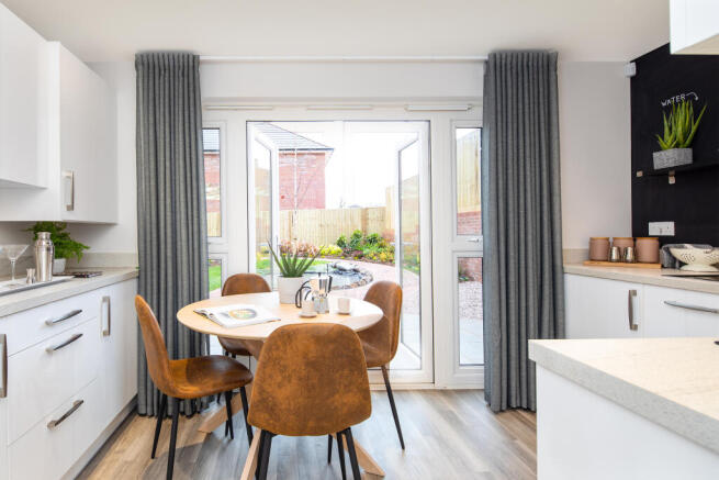 Kitchen with dining area and French doors in the Kenley 2 bedroom home