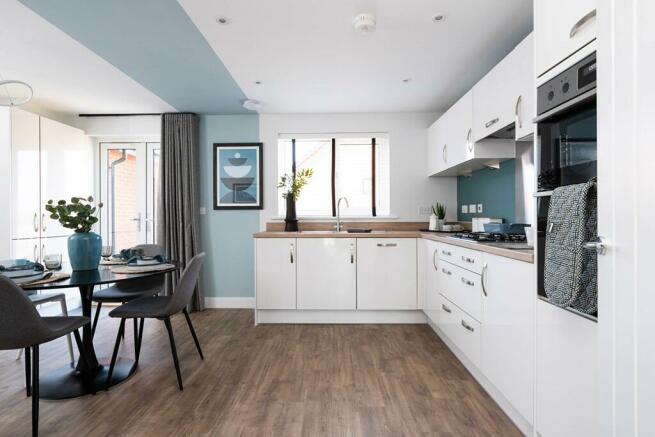 Lighted filled kitchen/dining area - typical Taylor Wimpey home