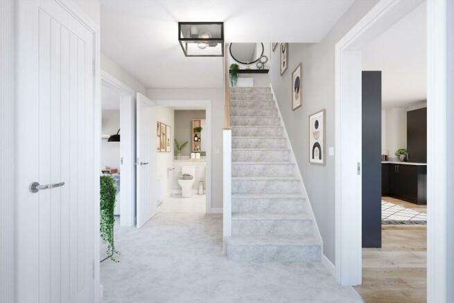 A welcoming hallway with a downstairs toilet and storage space