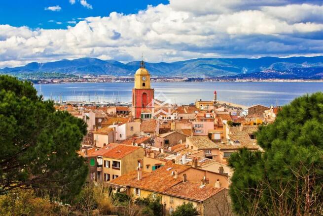 Saint Tropez village church tower and old rooftops