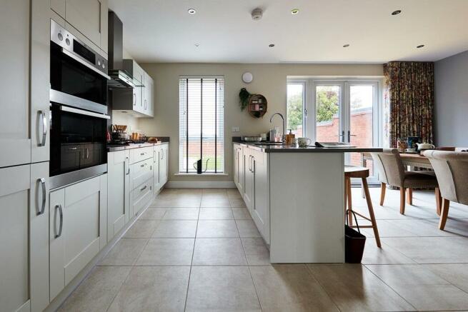 Modern kitchen with ample storage space and sociable breakfast bar