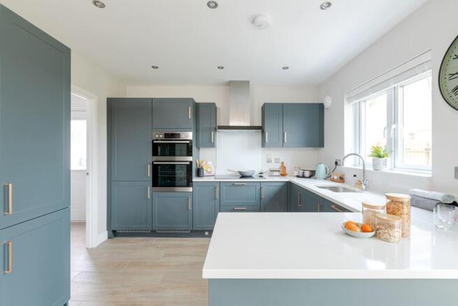 The modern kitchen has ample storage and worktop space