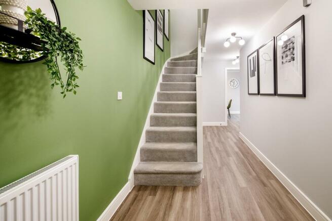Bright and spacious hallway with under stair storage