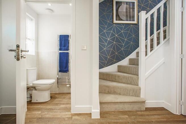 The Canford has a bright hallway with a convenient downstairs toilet