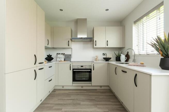 The modern kitchen has ample storage and worktop space