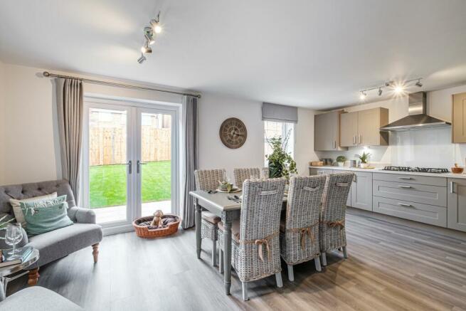 Hurst beige kitchen-diner with French doors to garden