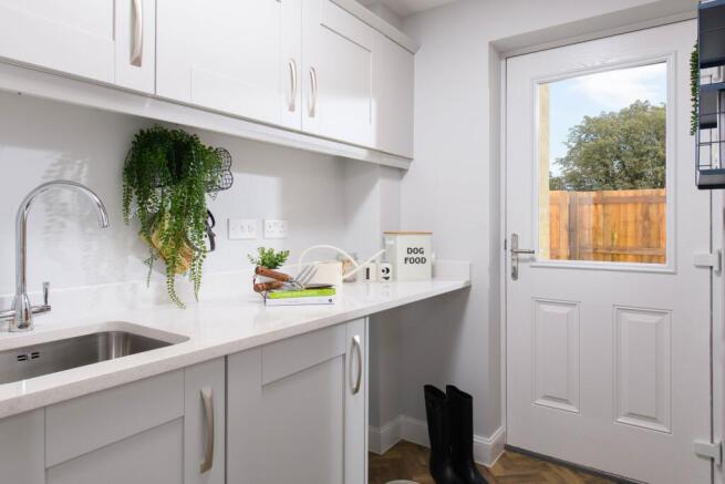 Separate utility area in Avondale style home with access to rear garden